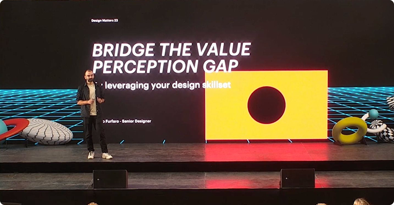Enrico on stage at Design Matters 2023, presenting Bridge the Value Perception Gap
